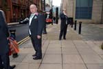 Man with a pink rose, Edmund Street.