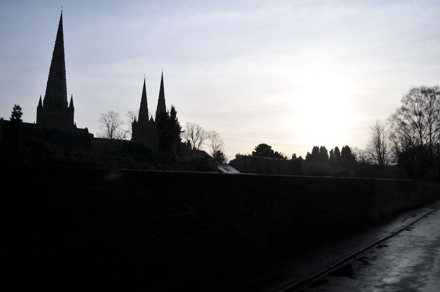 The cathedral from a wet lane.