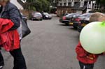 Boy with a green balloon.