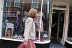 Lady passing the charity shop.